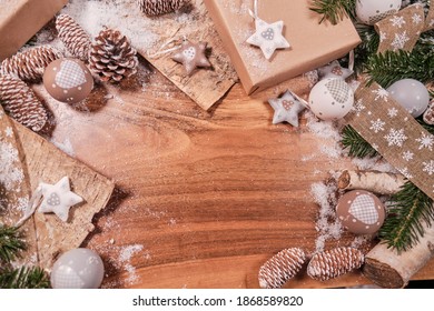 Christmas Composition With Spruce Branch And Gifts.  Wood Table . Top Down