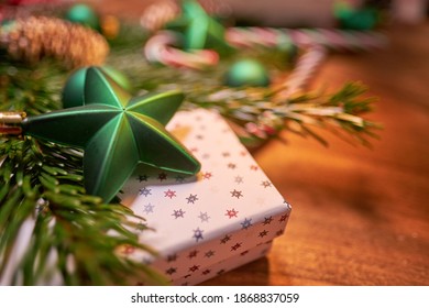 Christmas Composition With Spruce Branch And Gifts.  Wood Table . Top Down