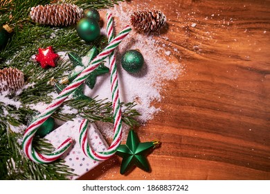 Christmas Composition With Spruce Branch And Gifts.  Wood Table . Top Down