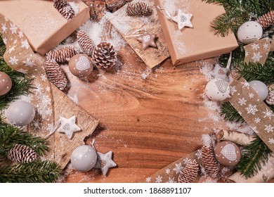 Christmas Composition With Spruce Branch And Gifts.  Wood Table . Top Down