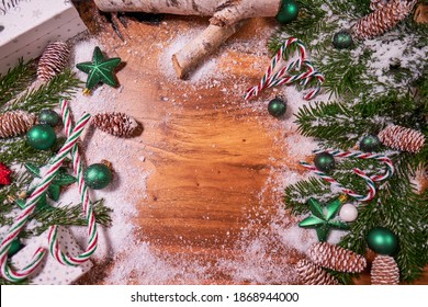 Christmas Composition With Spruce Branch And Gifts.  Wood Table . Top Down