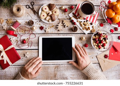 Christmas Composition With Tablet On A Wooden Background.