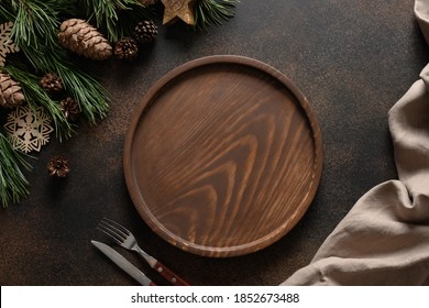 Christmas Composition Of Wooden Tray For Holiday Homemade Dish On Brown Cozy Home Table With Natural Decoration. Top View.