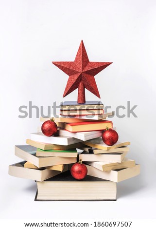 Christmas concept background. Books in the form of a christmas tree on white background