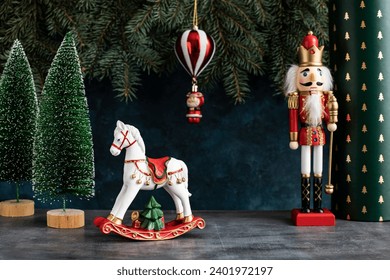 Christmas concept   background.  Christmas composition with horse toy and  Nutcracker toy soldier on festive background - Powered by Shutterstock