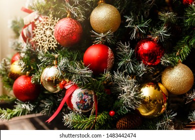 Christmas concept, lovely decorated Christmas tree, red glitter ball close up