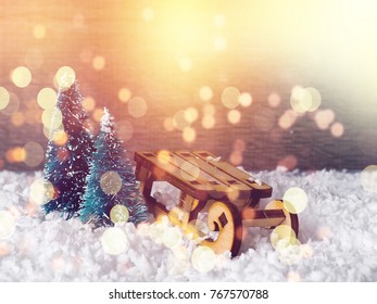 Christmas Concept, Toy Santa Sleigh, Gift Boxes On Snow And Blur Bokeh, Empty Wooden Sled