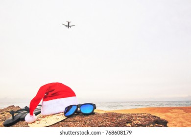 Christmas  Concept,A Plane Summer Holiday Background, Beach Accessories On The Beach, Vacation And Travel Items,In Tropical Phuket Thailand.