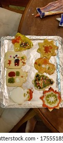 Christmas Cookies Decorated By  Little Kids On A Messy Kitchen Table. The Decorations Have Imperfections But It Is Quite A Fun Activity For The Young Ones