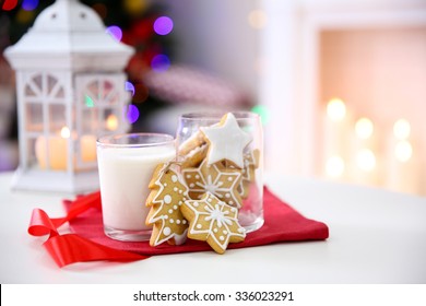 Christmas Cookies And Glass Of Milk On Table At Home 