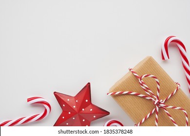 Christmas Corner Border With Gift, Candies And Ornament On White Background
