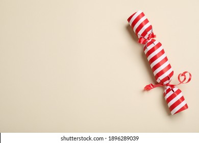 Christmas Cracker On Beige Background, Top View. Space For Text