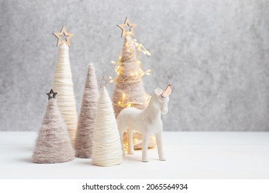 Christmas craft background with handmade yarn cone xmas trees in natural colors.  DIY organic sustainable christmas decoration - Powered by Shutterstock