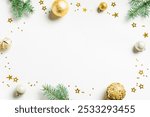 Christmas creative composition with fir green branches, golden baubles and stars, isolated on white background, top view, copy space. Christmas celebration layout, template with festive ornaments.