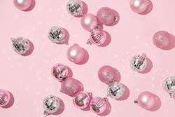 Christmas Creative Layout With Pink Christmas Baubles And Disco Ball Decoration On Pastel Pink Background. 80s Or 90s Retro Fashion Aesthetic Concept. Minimal New Year Or Christmas Celebration Idea.