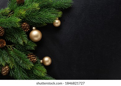 Christmas Deco With Fir And Baubles On Dark Background. Flat Lay. Christmas Concept 