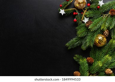 Christmas Deco With Fir And Baubles On Dark Background. Flat Lay. Christmas Concept 