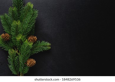 Christmas Deco With Fir On Dark Background. Flat Lay. Christmas Concept 