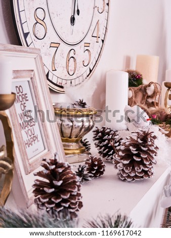 Christmas decor, New Year's card scenery, New Year Clock with candles and photoframe. New Year concept.