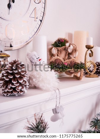 Christmas decor, New Year's card scenery, New Year Clock with candles, snowman and photoframe. New Year concept