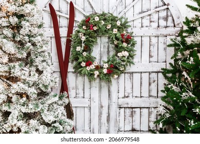 Christmas decorated house and yard. Studio decoration in New Year style. Snow covered courtyard of a wooden house or cottage. Backdrop for photographer