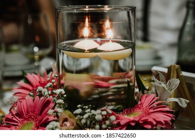 Christmas Decoration With Candle. Centerpiece With Natural Flowers, Candles And Water