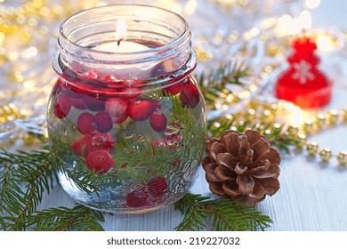 Christmas Decoration. Candle In Glass Jar With Cranberry And Fir