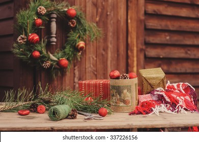 christmas decoration at cozy rustic wooden country house with wreath on background - Powered by Shutterstock