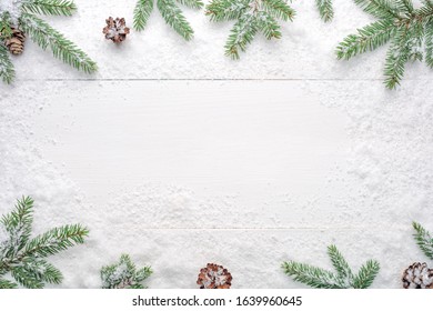 Christmas Decoration Of Fir Tree And Conifer Cone On Wood Background, Top View. Copy Space