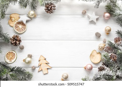 Christmas Decoration Of Fir Tree And Conifer Cone On Wood Background, Top View. Copy Space