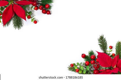 Christmas decoration. Frame of flowers of red poinsettia, branch christmas tree, red berry on a white background with space for text. Top view, flat lay - Powered by Shutterstock