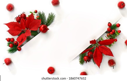 Christmas decoration. Frame of flowers of red poinsettia, branch christmas tree, apple, red berry with white paper card note with space for text on a white background. Top view, flat lay - Powered by Shutterstock