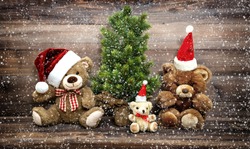 Christmas Decoration With Funny Toys Teddy Bear Family. Vintage Style Toned Picture With Falling Snow Effect