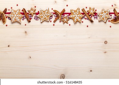 Christmas Decoration And Gingerbread Cookies On Wooden Background With Empty Copy Space For Your Text. Holiday, Celebration And Cooking Concept. New Year And Christmas Postcard Or Invitation