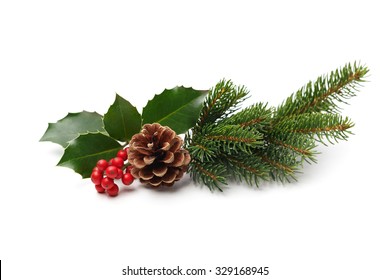 Christmas decoration of holly berry and pine cone - Shutterstock ID 329168945