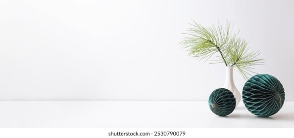 Christmas decoration in home interior, scandinavian style. Green pine branches in a vase on a white table - Powered by Shutterstock