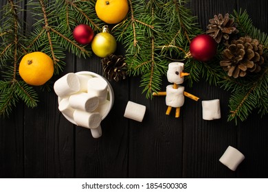 Christmas Decoration On Wooden Background. Flatley. Snowman, Marshmellow, Christmas Tree, Cones, Christmas Toys, Tangerines