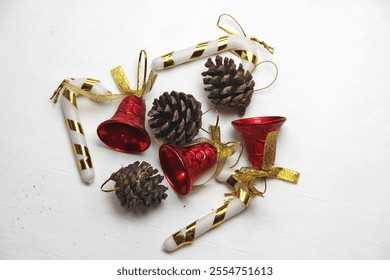 Christmas decoration, red bell, gift box, candy cane, christmas stick, pine cone - Powered by Shutterstock