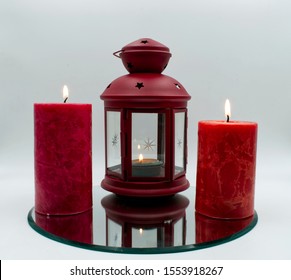 Christmas Decoration. Red Candles And Christmas Ornaments, White Background