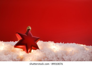 Christmas decoration star with snow  on red background - Powered by Shutterstock