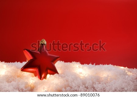 Christmas decoration star with snow  on red background