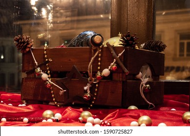 Christmas Decoration Of Stars, Balls, Wine In A Wooden Box On The Window In The Cafe. Christmas Mood In The Restaurant.