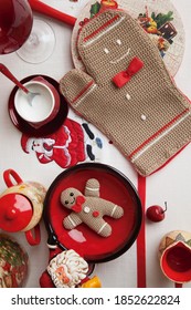 Christmas Decoration Table With An Oven Glove And A Cuddly Gingerman.