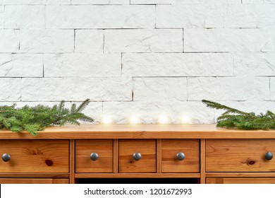 Christmas Decoration With Twigs Of Spruce On An Old Shelf On The Background Of A White Brick Wall