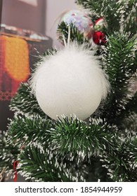 
christmas decoration white ball with fluff on christmas tree - Shutterstock ID 1854944959