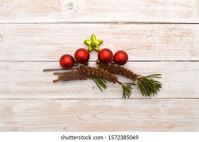 Christmas Decorations With Callistemon Bottlebrush Plant Seed Pods Whitewashed Wood Table Background