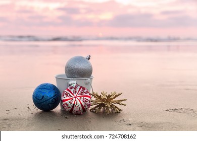 Christmas Decorations At Carlsbad State Beach At Sunset On The Background Of Sea In San Diego, Holiday Concept