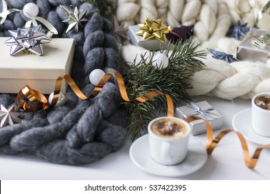 Christmas Decorations And Coffee Cups With Chunky Blanket