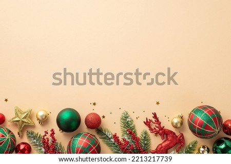 Christmas decorations concept. Top view photo of green and red baubles gold star reindeer ornament confetti mistletoe berries and pine branches on isolated beige background with empty space