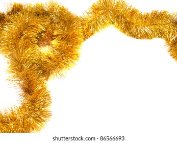 Christmas Decorations Of Gold Tinsel Isolated Over White Background